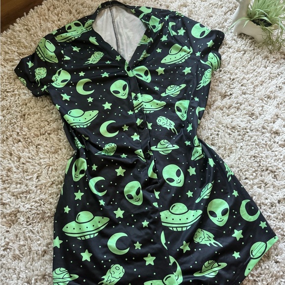 Pants - Green and black alien print romper with a V-neck and short sleeves,